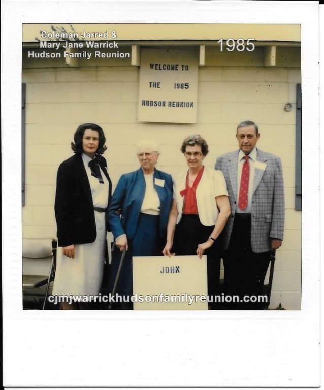 1985 - Family of John: Colline Roberts, Sallie Hudson Roberts, Grey Hudson (holding family sign), Lucian Hudson